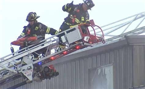 Crews cut through steel walls to fight warehouse fire in Everett